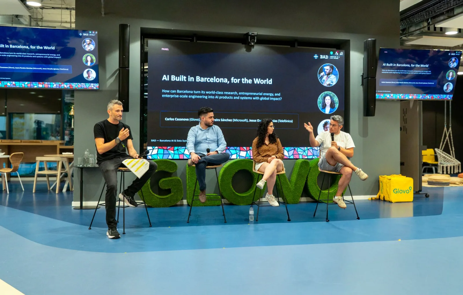 Four panelists discussing AI built in Barcelona on the Glovo stage