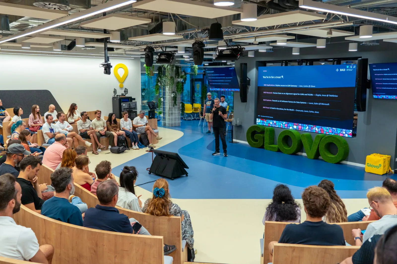 The BAD Meetup audience facing the stage at Glovo Yellow Park