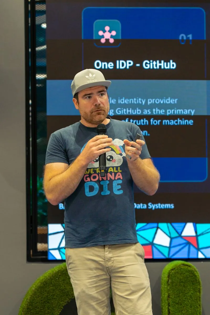A speaker presenting platform infrastructure on the BAD Meetup stage